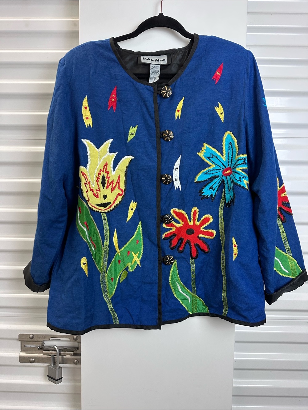 Indigo Moon Blue Jacket with Black Trim and Gold-Accented Button